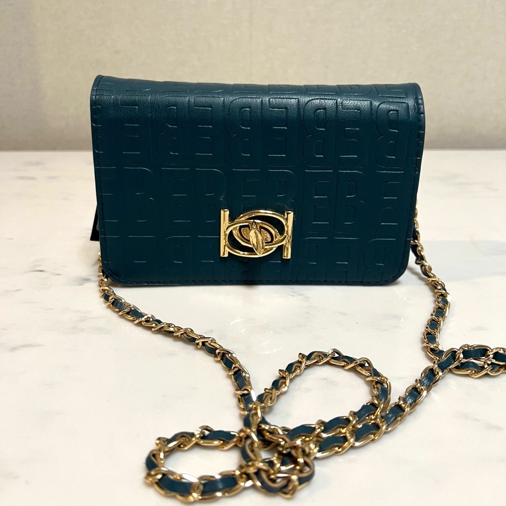Bebé mini monogram bag, chain faux leather woven through, teal, new with tags.